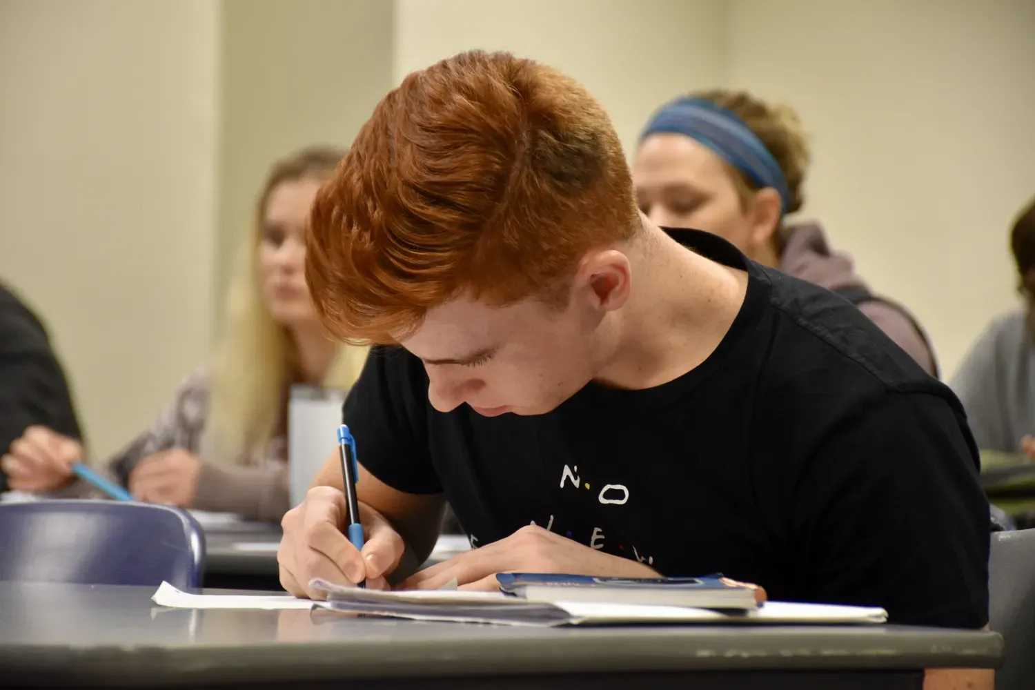 Student taking notes