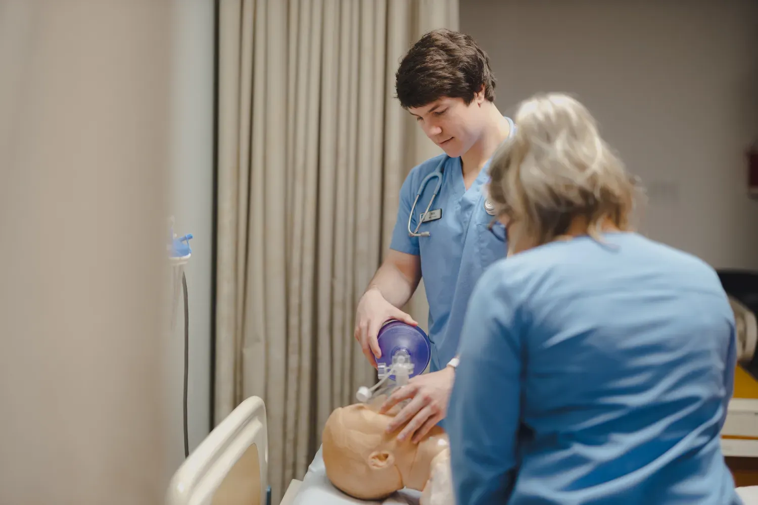 Student working in nursing simulation lab