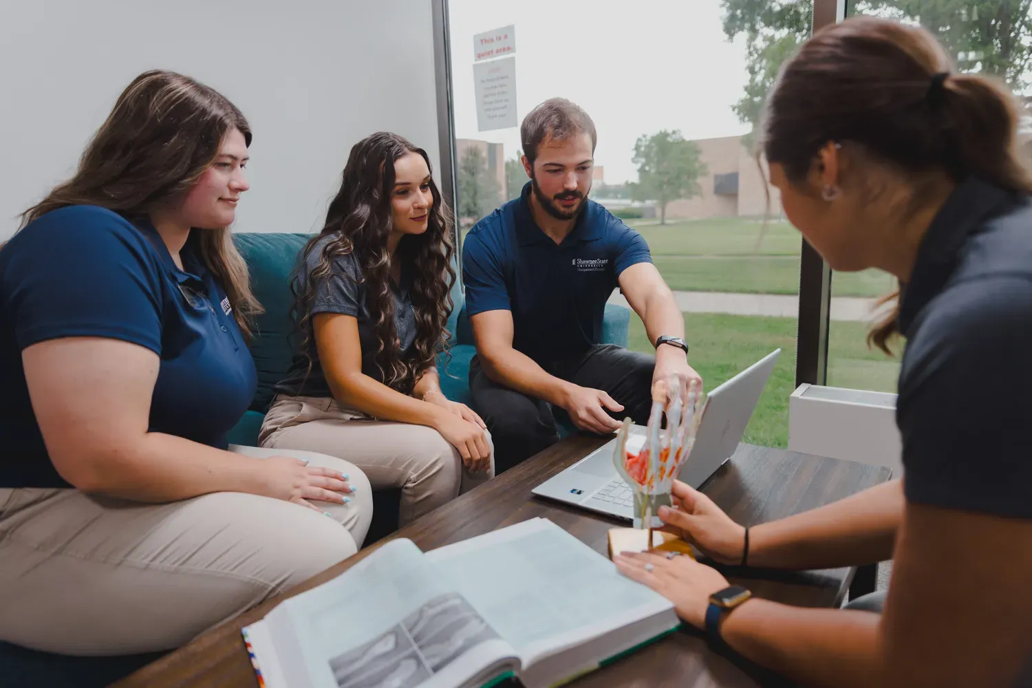Students analyzing muscles in the hand