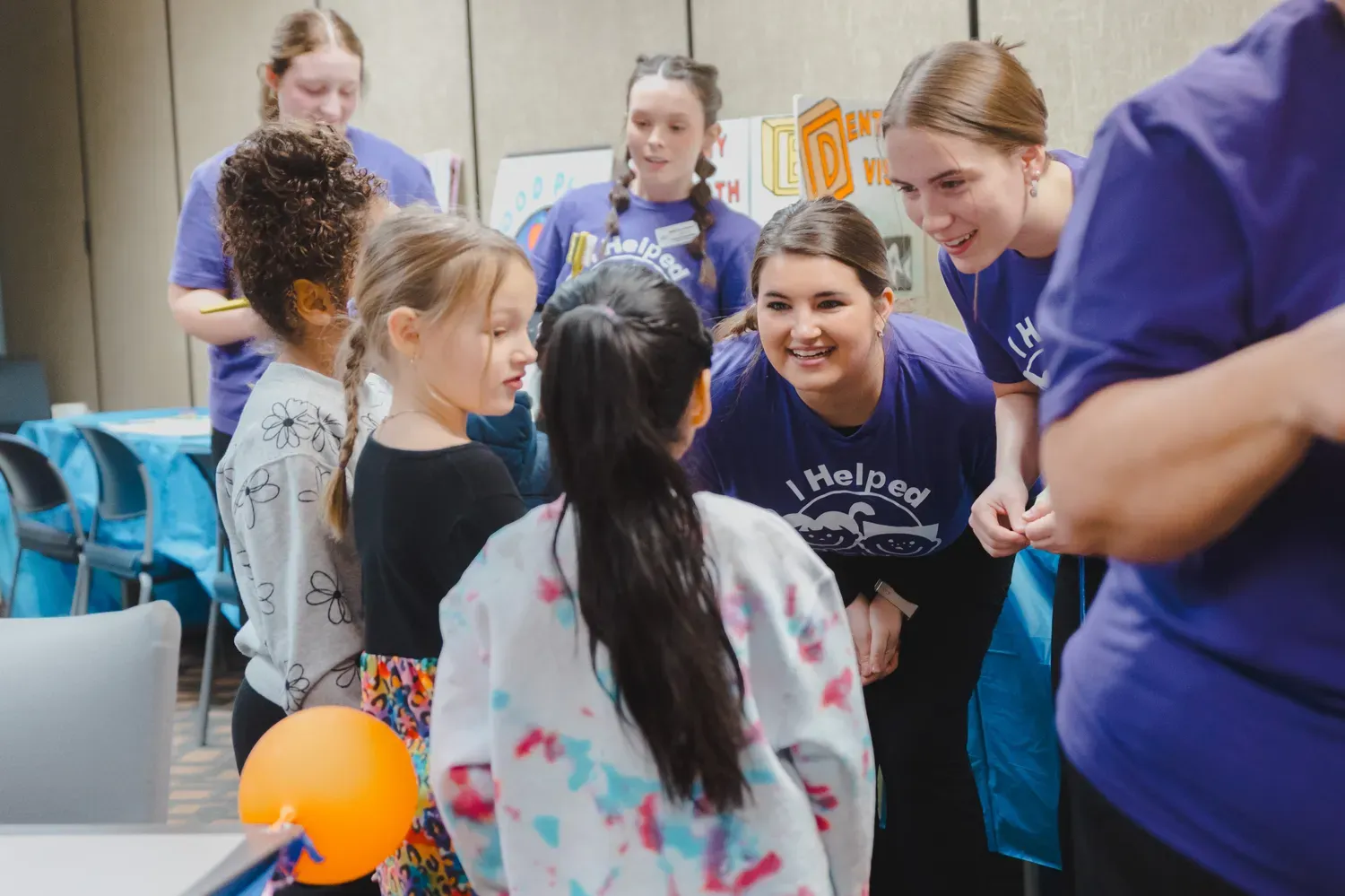 teachers and students in a circle talking