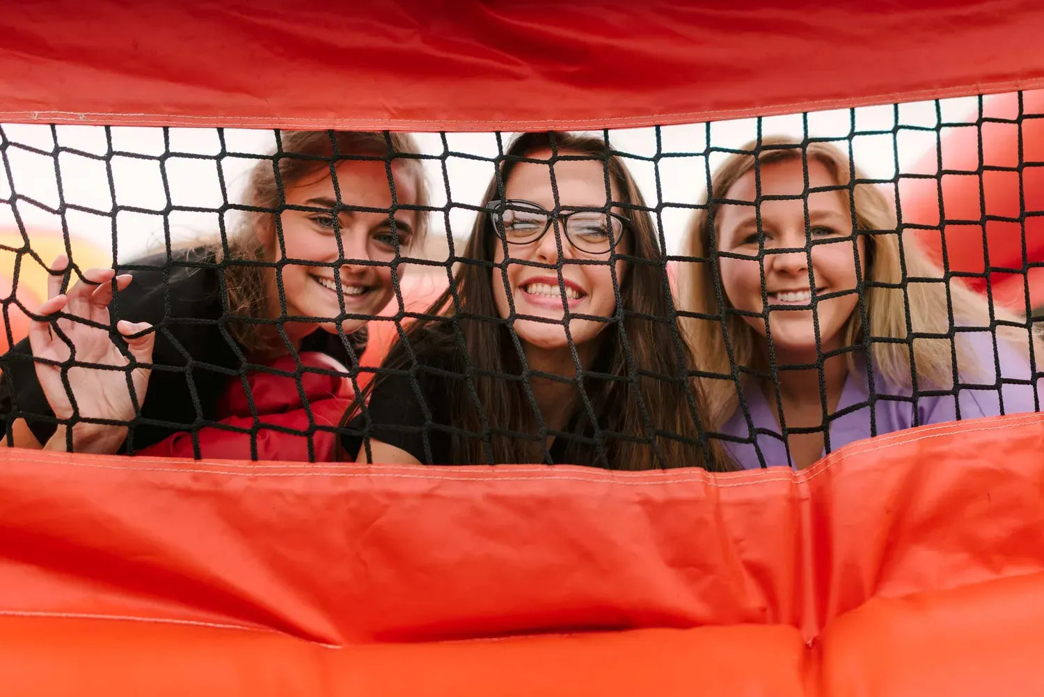 Three students smiling