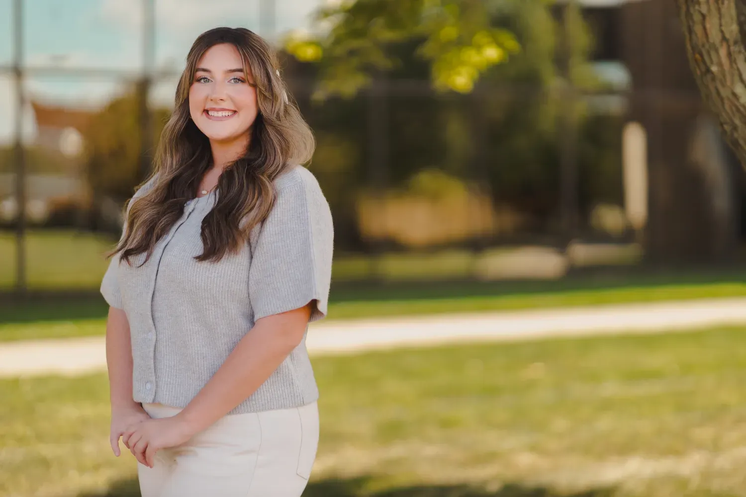 Student smiling outside