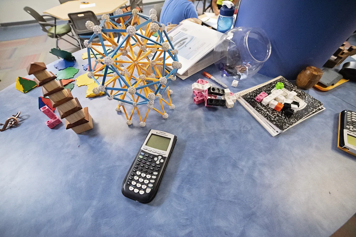 desk with calculator and math supplies