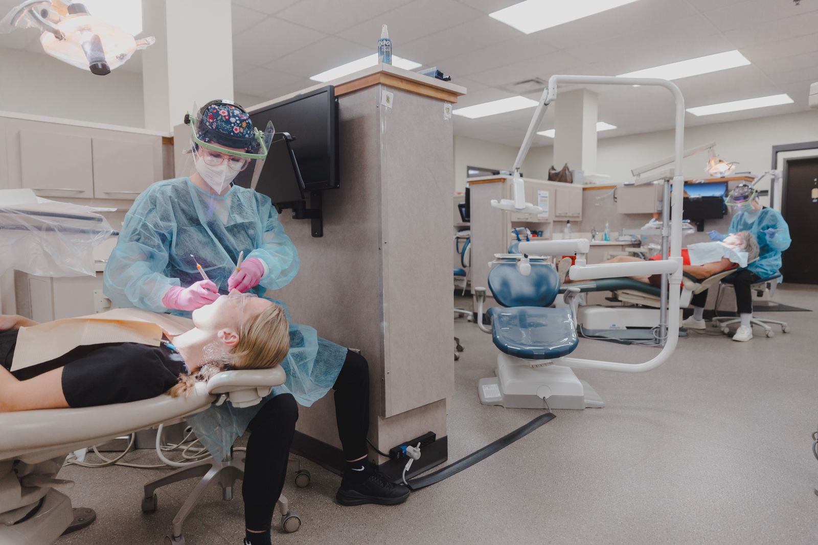 Dental students working with patients