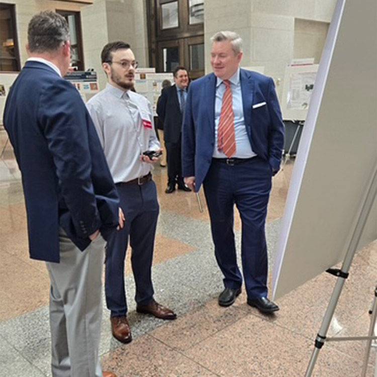 SSU Computer Engineering Technology student Parker Lauders (middle) presents his research “Development and Implementation of Smart Robot Assistant Swimming Coach” to Ohio Department of Higher Education Chancellor Mike Duffey (right) at the Scholar Showcase celebrating Choose Ohio First recipients.