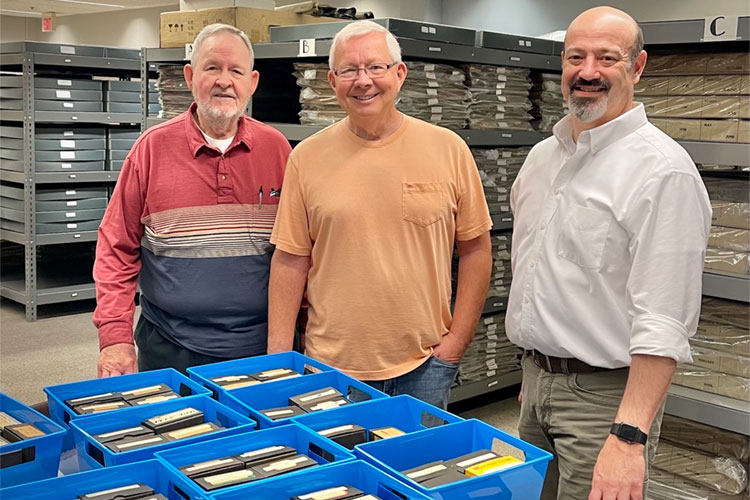 Charles Bayless, Butch Stall, and Andrew Feight, Ph.D. standing in the Portsmouth Daily Times building