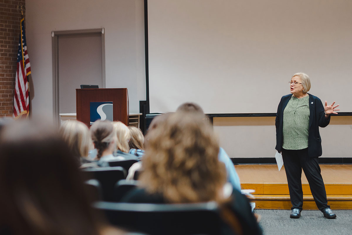 Dr. Christine Raber lecturing a class of students